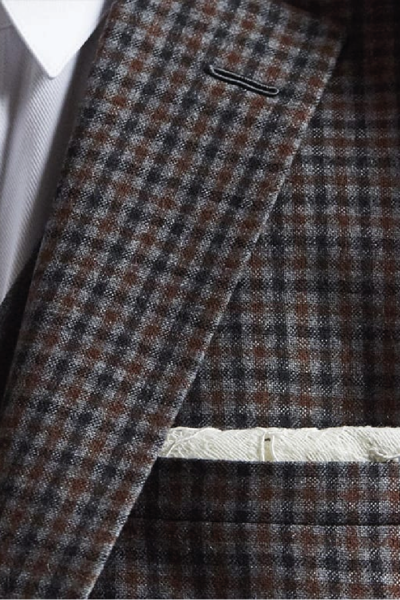 Entoilage traditionnel ou thermocollé : le détail invisible qui décide de la longévité d’une veste
